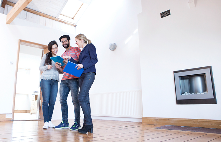 Couple viewing home with a realtor.